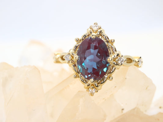 Art Deco Vintage Oval Cut Diamond Engagement Ring in Yellow Gold with Lab Created Alexandrite Accent