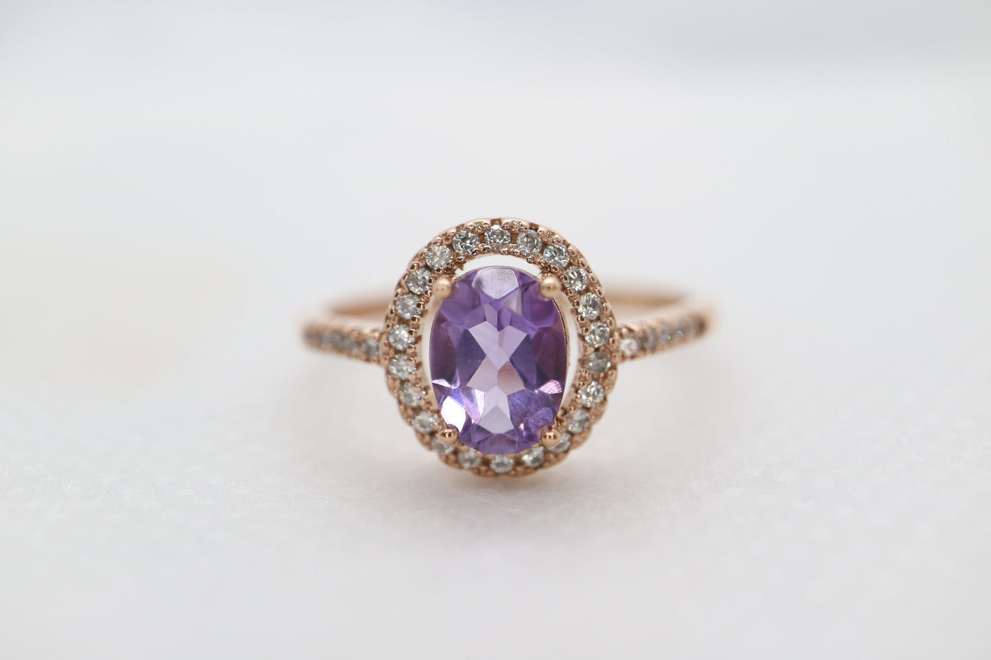 Natural ova cut Tanzanite halo ring set in 18k rose gold, Natural tanzanite ring in rose gold, Sterling silver ring