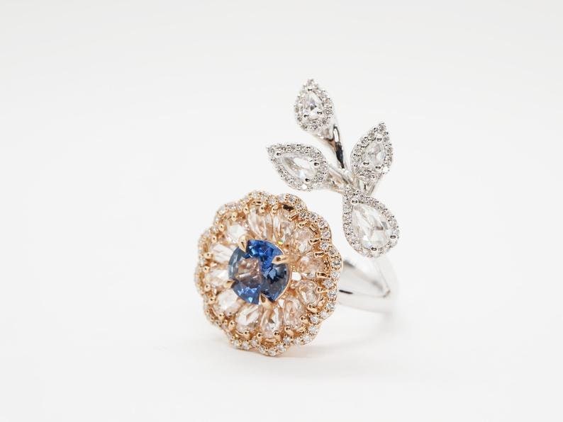 Diamond and sapphire flower ring with diamond leaf and blue sapphire solitaire centre, Rose gold flower ring with rose cut diamonds