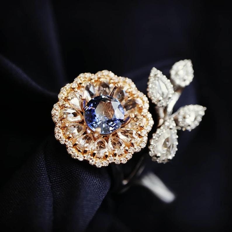 Diamond and sapphire flower ring with diamond leaf and blue sapphire solitaire centre, Rose gold flower ring with rose cut diamonds