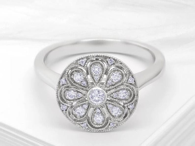 Art deco diamond ring with round cut out pattern, Diamond and white gold engagement ring with brilliant round cut diamond, Art deco ring