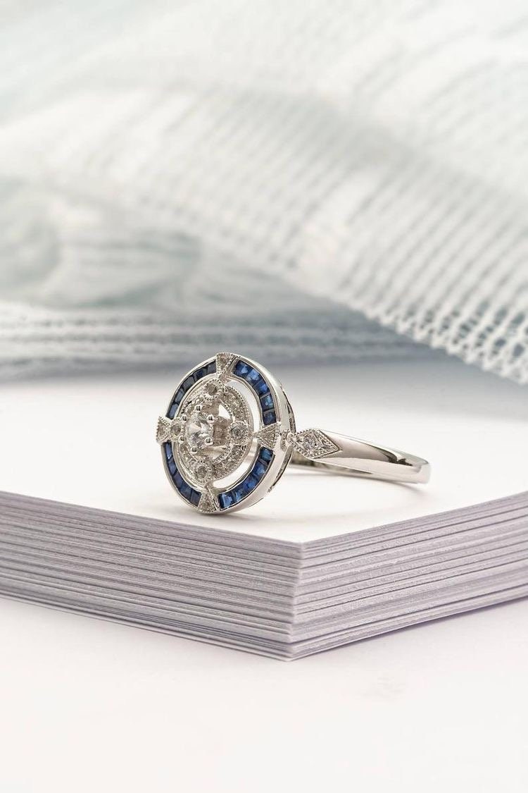 Antique art deco inspired white gold ring with diamond and blue sapphire  halo