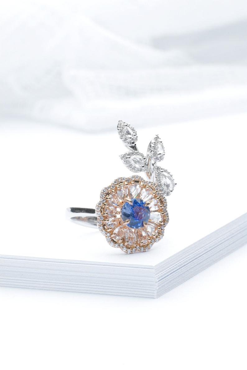 Diamond and sapphire flower ring with diamond leaf and blue sapphire solitaire centre, Rose gold flower ring with rose cut diamonds