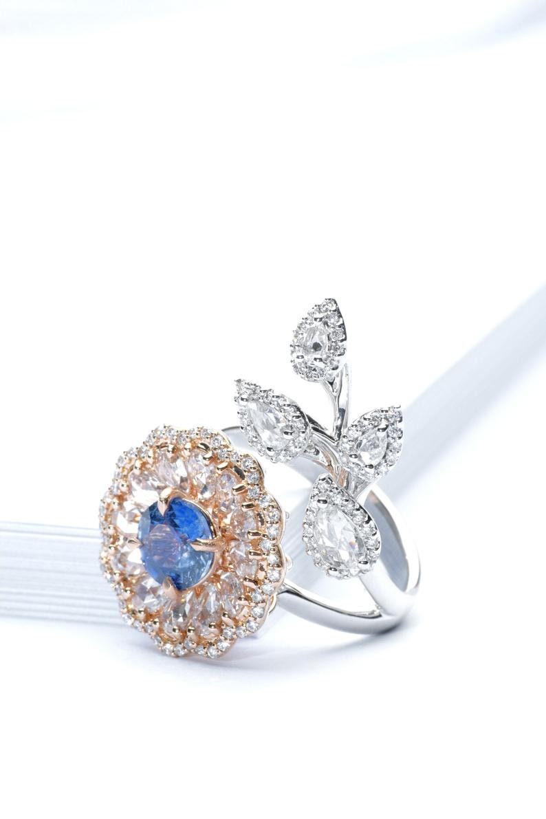 Diamond and sapphire flower ring with diamond leaf and blue sapphire solitaire centre, Rose gold flower ring with rose cut diamonds