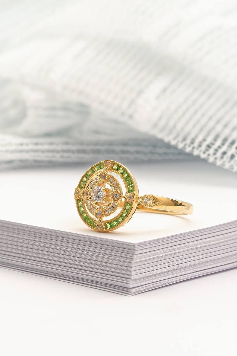 Antique Art Deco inspired yellow gold ring with diamond and peridot halo